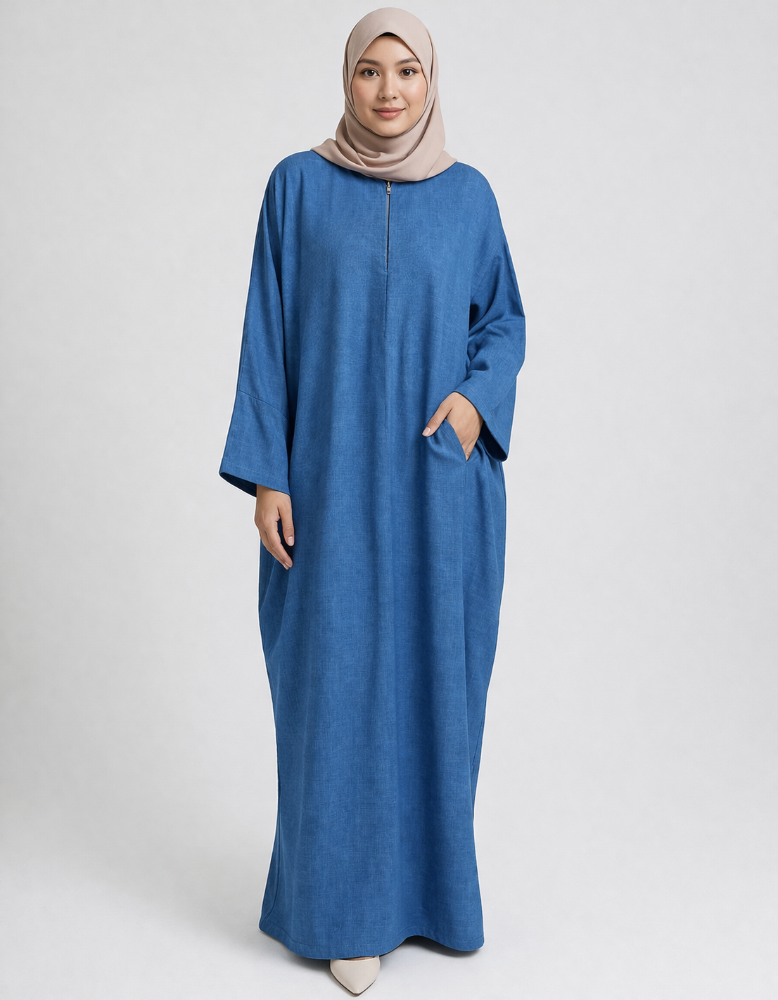 minimalist fashion portrait in blue abaya